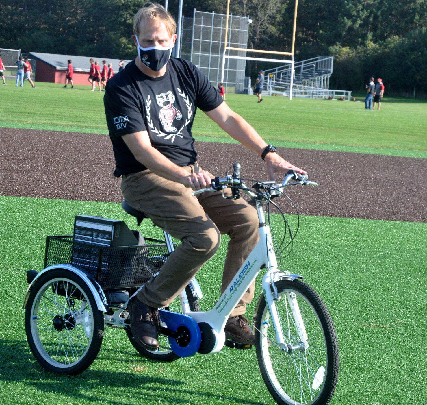 Badger High School Assistant Principal Michael Giovingo tests takes an electric bike